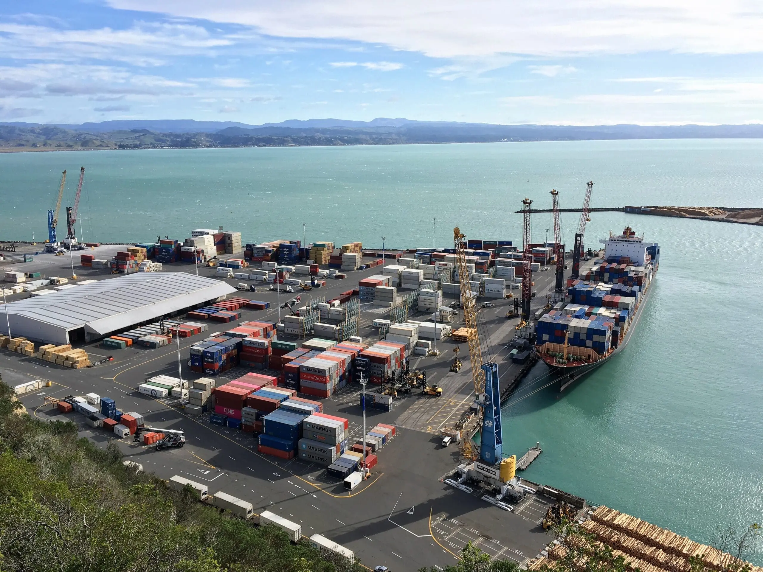 Port of Napier with a container ship at dock. Newly poured highly-modified pavement resists strain of port activities