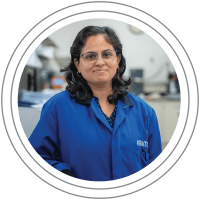 Our People: Woman of Indian decent smiling at the camera